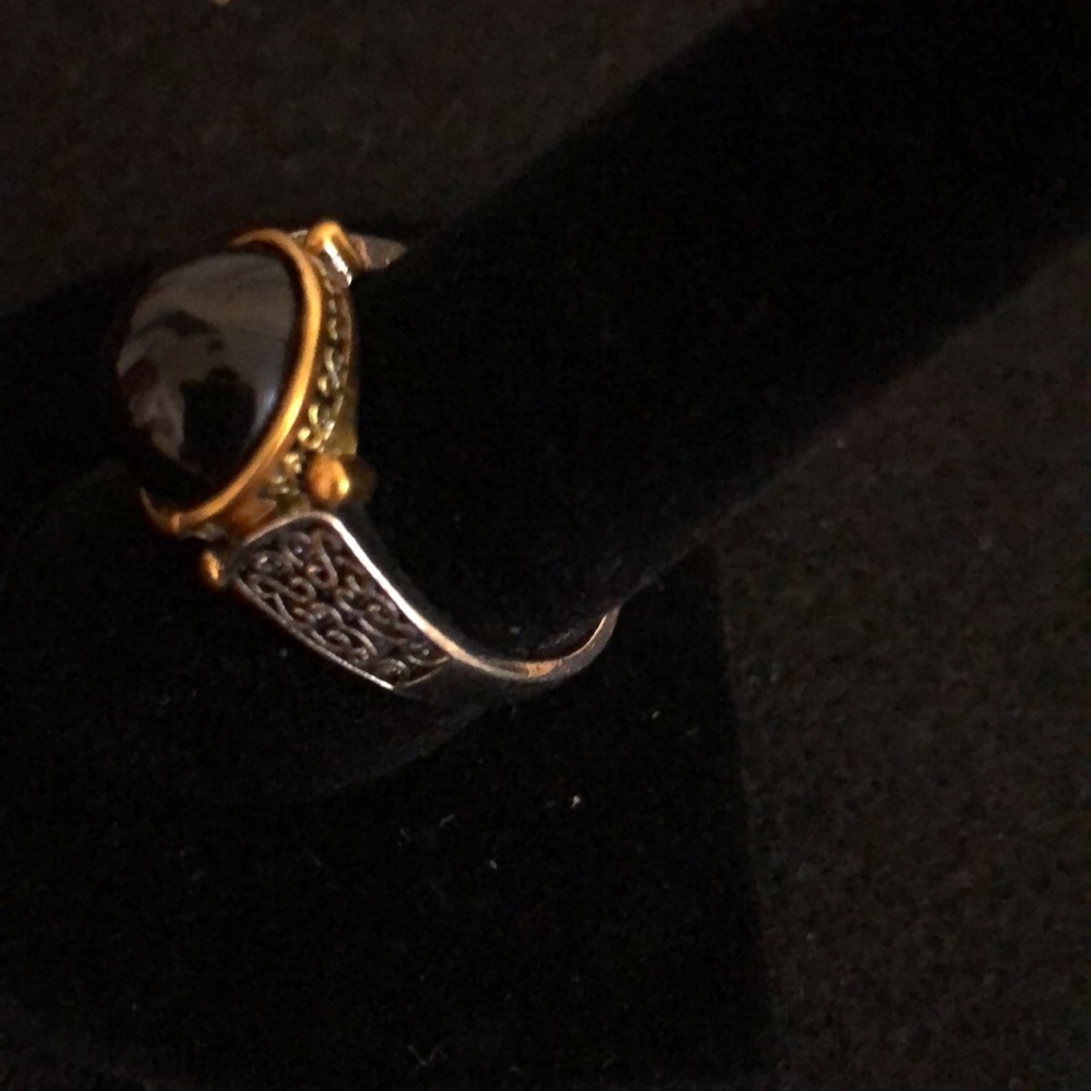 Amethyst ring with a silver band and gold around the stone size 8 NWOT